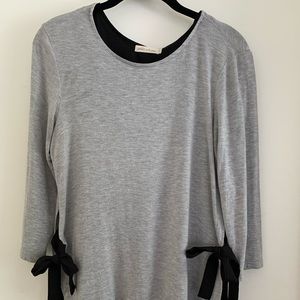 Long blouse with side ties on bottom.